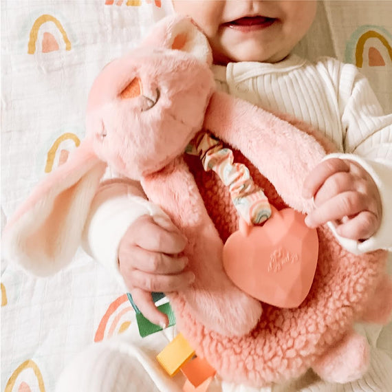'- Itzy Lovey Including Teether - Baby Lovey with Teether, Textured Ribbons & Dangle Arms - Features Crinkle Sound, Sherpa Fabric and Minky Plush (Pink Bunny)